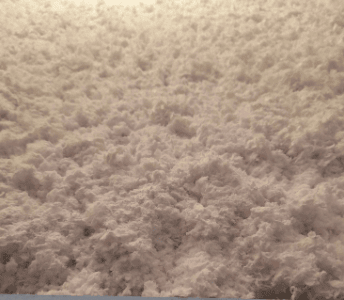 blown in insulation product that looks like white cotton balls or icy snow